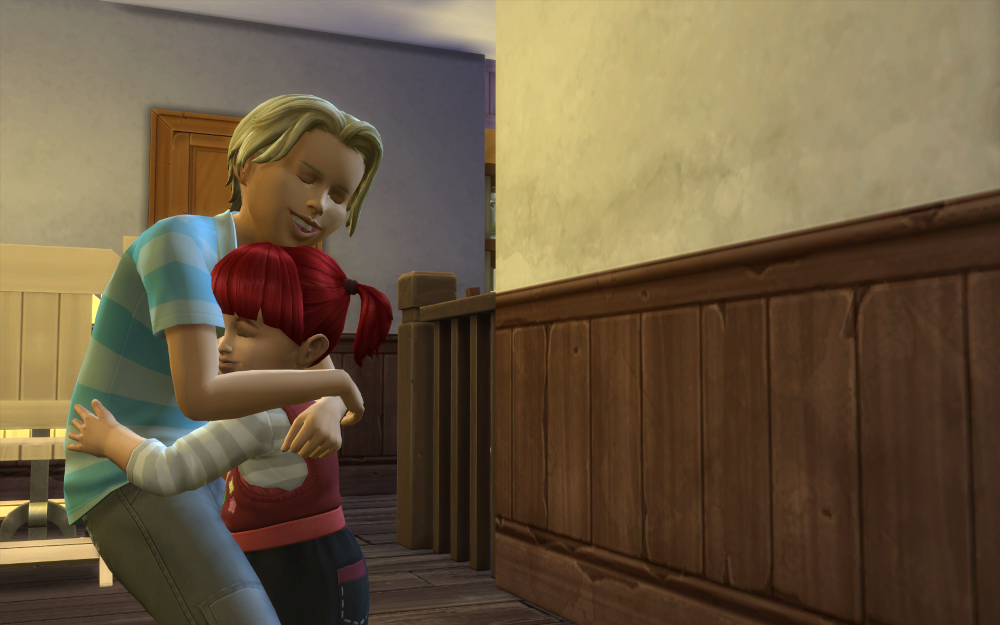 Theo hugs his little sister. (She's got her father's red hair).