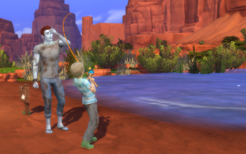 Adam tries to teach Theo how to fish. It's not going well and both are covered in dirt.